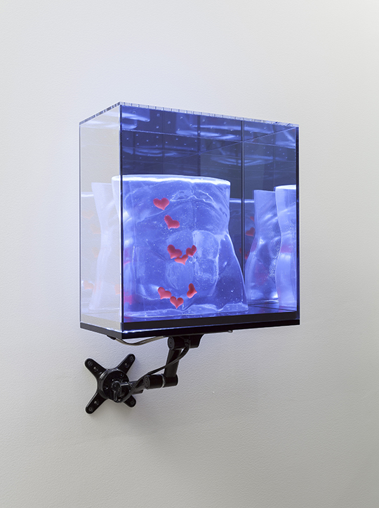 Fever and Spear, 2014, resin, plastic hearts, two-way mirror Plexiglas, powder-coated steel wall mount, 41.91 x 40.64 x 20.32 cm