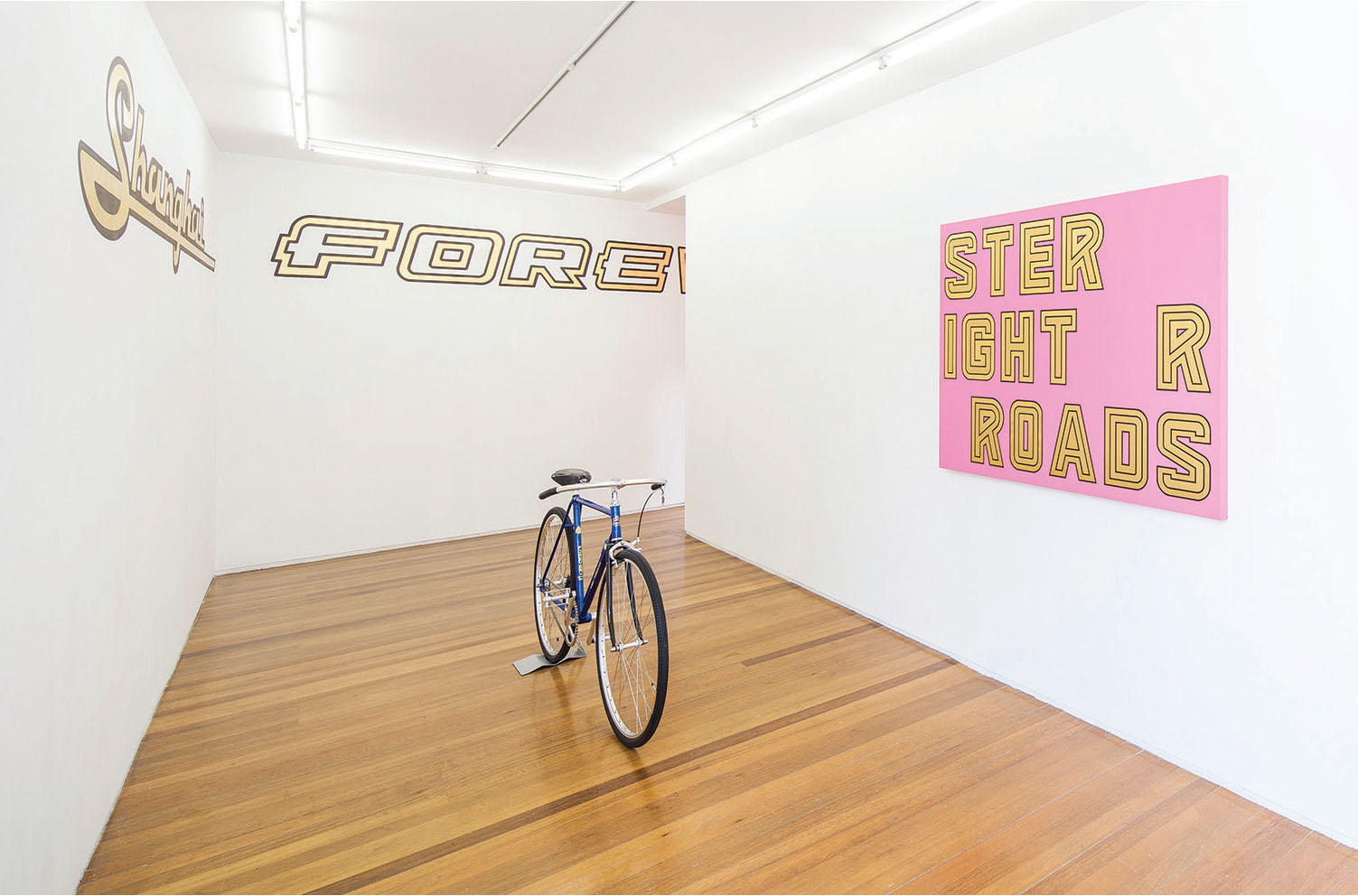 Left: Shanghai Forever, 2016, gold leaf and paint on wall, each character 43 x 64 cm Center: Huashan Road, 2016, artist-reassembled Forever bicycle, 94 x 175 x 46 cm Right: Untitled, 2016, acrylic and gold leaf on canvas, 102 x 150 cm Courtesy Leo Xu Projects PHOTO: JJY Photo